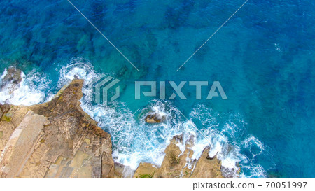 Wild Ocean water from above - Waves hitting the rocks Wild Ocean water from above - Waves hitting the rocks 70051997