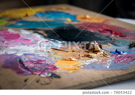 Artist's color palette. Dried oil paint. Creativity and art Artist's color palette. Dried oil paint. Creativity and art 70053422