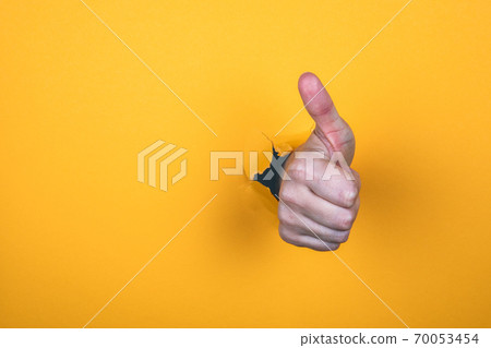 Thumbs up. Social media, marketing and teamwork concept. Woman's hand Thumbs up. Social media, marketing and teamwork concept. Woman's hand 70053454