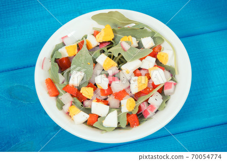 Fresh salad in glass bowl on boards, dieting and healthy nutrition concept 70054774