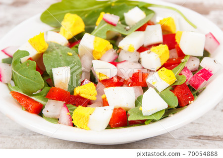 Fresh prepared salad in glass bowl, healthy nutrition concept Fresh prepared salad in glass bowl, healthy nutrition concept 70054888