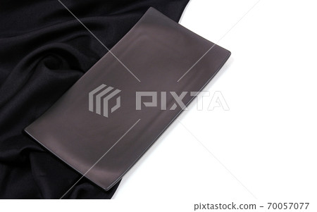 Empty black rectangle modern ceramic plate with silk tablecloth texture on white background , Top view 70057077