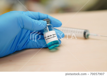 Coronavirus Covid-19 vaccine development medical with syringe for doctor use to treat pneumonia illness patients. 70057907