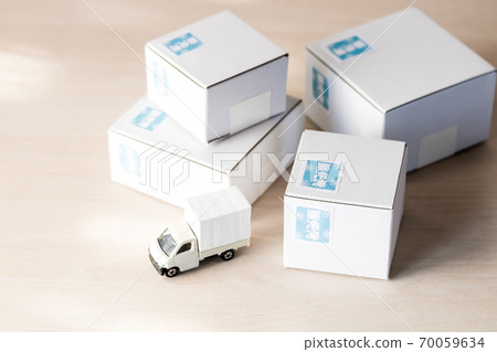 White cardboard and delivery vehicle White cardboard and delivery vehicle 70059634