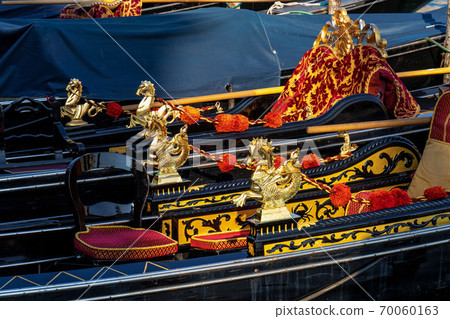 Close up of golden seahorses details on a gondola in Venice, Italy. Close up of golden seahorses details on a gondola in Venice, Italy. 70060163