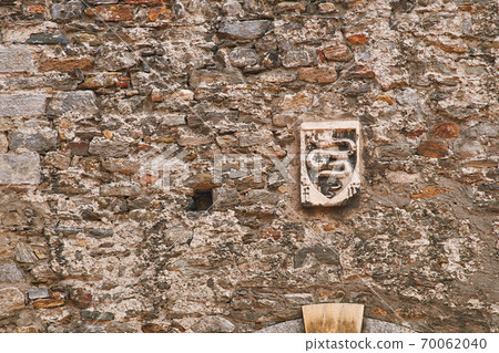 Coat of arms of Swiss city of Bellinzona on the old town wall 70062040