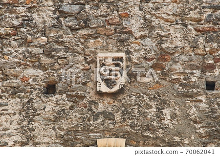 Coat of arms of Swiss city of Bellinzona on the old town wall 70062041