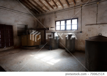Old winery in Spain. The rays of the sun come through the window 70062514