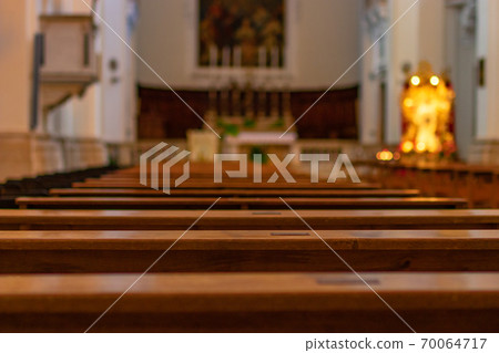 Empty church benches in the Catholic Church 70064717