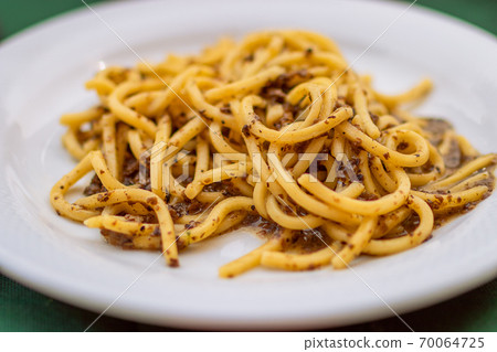 Spaghetti (Spaghettoni) with mushrooms. Traditional Italian dish. Spaghetti (Spaghettoni) with mushrooms. Traditional Italian dish. 70064725