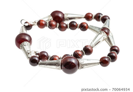tangled necklace from brown agate beads isolated 70064934