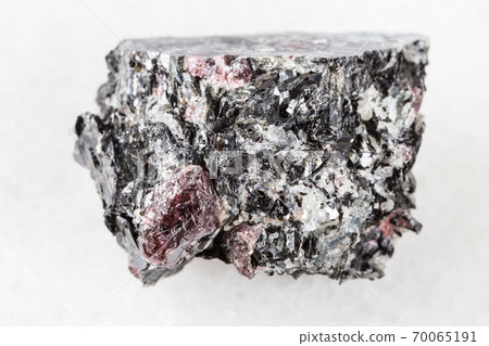 unpolished red Garnet crystals in Biotite on white unpolished red Garnet crystals in Biotite on white 70065191
