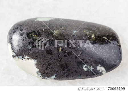 tumbled Teisky Jade (Hantigyrite) rock on white tumbled Teisky Jade (Hantigyrite) rock on white 70065199