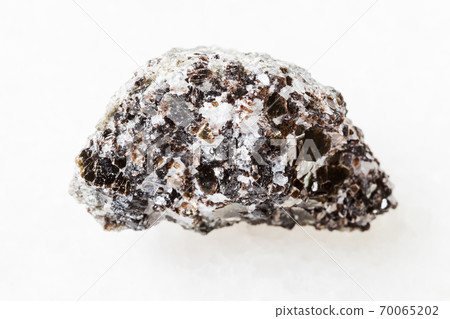 raw Phlogopite (magnesium mica) rock on white 70065202