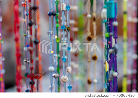 Homemade multi-colored beads. Abstract color background. 70065456