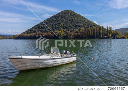 The Boat on the lake - Piediluco, pyramid island in the background. Umbria, Italy 70065667