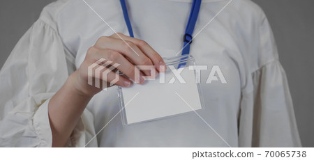 Woman showing a blank ID card Woman showing a blank ID card 70065738
