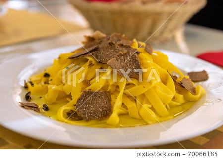 Italian fettuccine pasta with black truffle and olive oil 70066185