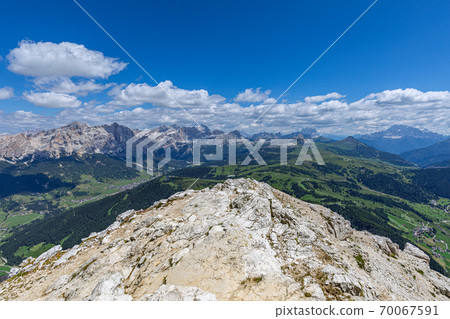Stunning panoramic view of Italian Dolomites from the top of the  Sassongher  mountain 70067591