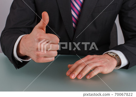 Close up businessman hand showing thumb up. Close up businessman hand showing thumb up. 70067822