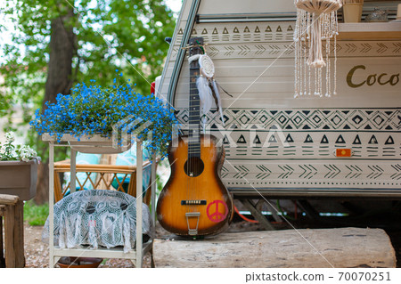 Summer cafe in a green park. Themed hipster cafe in the city park. Decor items 70070251