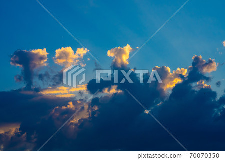 Heavy cloudy sky at sunset. A landscape of beautiful nature Heavy cloudy sky at sunset. A landscape of beautiful nature 70070350