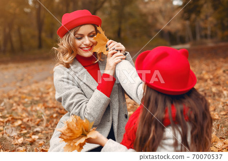 Cute and stylish family in a autumn park 70070537