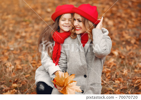 Cute and stylish family in a autumn park 70070720