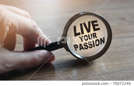 Live Your Passion words under magnifying glass on wooden table. career concept Live Your Passion words under magnifying glass on wooden table. career concept 70072246