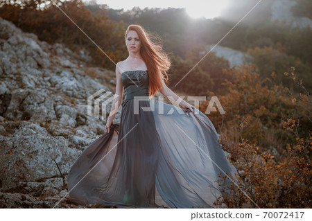 beautiful furious scandinavian warrior ginger woman in grey dress beautiful furious scandinavian warrior ginger woman in grey dress 70072417