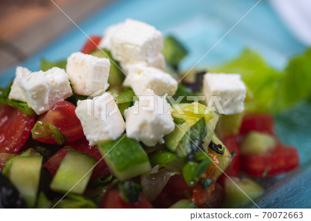 Fresh salad from chopped vegetables. 70072663