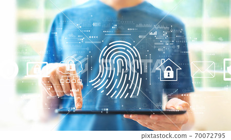 Fingerprint scanning theme with man using a tablet 70072795