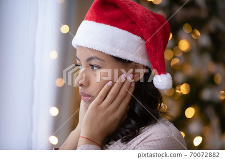 Sad african American woman feel lonely on Christmas day Sad african American woman feel lonely on Christmas day 70072882