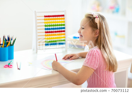 Child drawing. Kids paint. Girl after school. Child drawing. Kids paint. Girl after school. 70073112