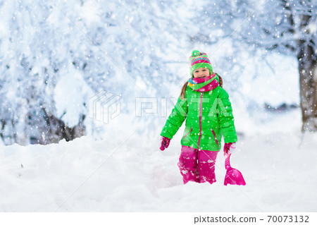 Girl on sled ride. Child sledding. Kid on sledge Girl on sled ride. Child sledding. Kid on sledge 70073132