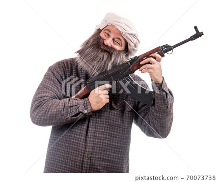 The bearded man armed with kalashnikov isolated on a white background. The bearded man armed with kalashnikov isolated on a white background. 70073738