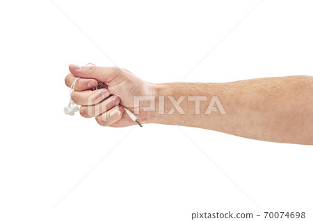 male hands are holding white headphones isolated on white 70074698