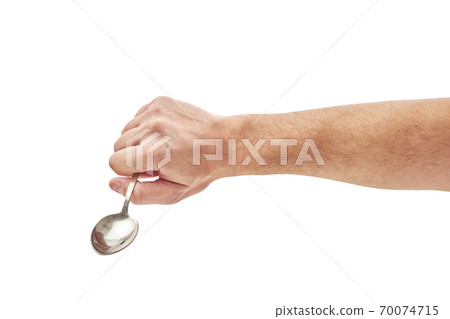 hand holding spoon isolated on white background hand holding spoon isolated on white background 70074715