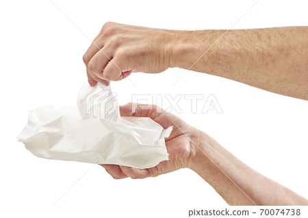 Man cleaning his hand with wet tissue isolated on white background Man cleaning his hand with wet tissue isolated on white background 70074738