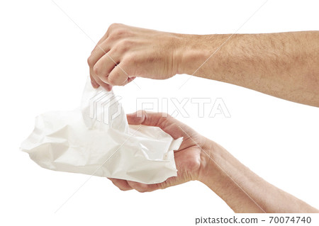 Man cleaning his hand with wet tissue isolated on white background Man cleaning his hand with wet tissue isolated on white background 70074740