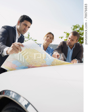 Business People Planning Car Trip Consulting Map For Directions Business People Planning Car Trip Consulting Map For Directions 70078883