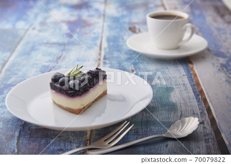 Cheesecake blueberry on wooden table Cheesecake blueberry on wooden table 70079822