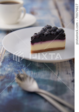 Cheesecake blueberry on wooden table Cheesecake blueberry on wooden table 70079827