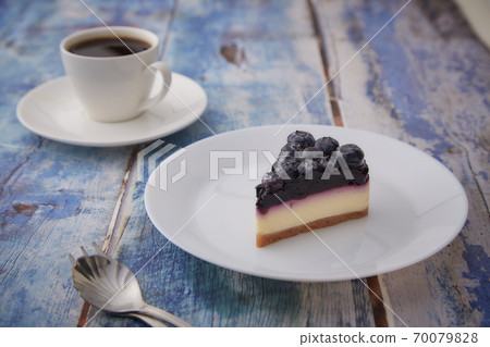 Cheesecake blueberry on wooden table 70079828