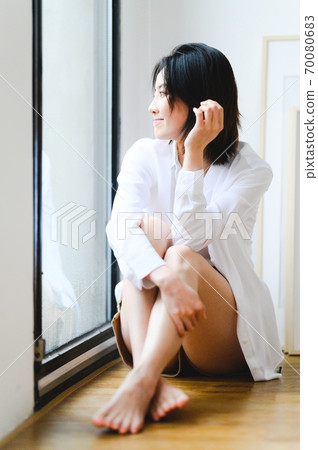 Young beautiful oriental young women at home daily 70080683