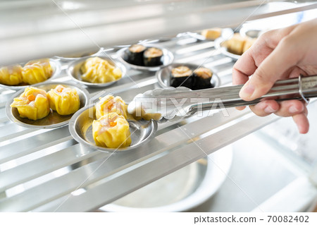 Chinese Preparing vegetable dim sum (yumcha). Asian Food chinese traditional food cuisine. Chinese Preparing vegetable dim sum (yumcha). Asian Food chinese traditional food cuisine. 70082402