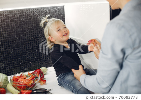 Beautiful family prepare food in a kitchen 70082778