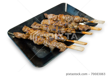 Die cut of Grilled beef on a grilled skewer on white isolated, focus selective. Die cut of Grilled beef on a grilled skewer on white isolated, focus selective. 70083863