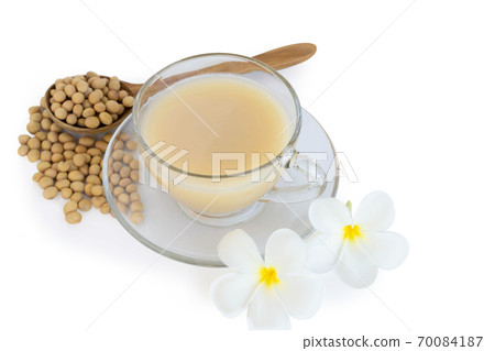 Soymilk in glass with soy beans in wooden spoon isolated on white background, health care concept 70084187