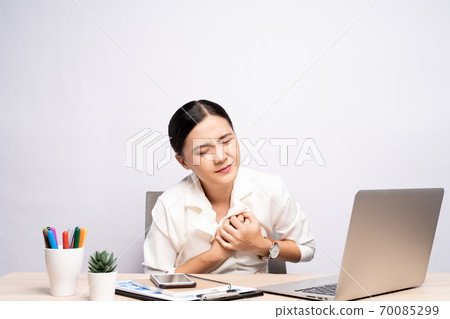 Woman has chest pain at office isolated over white background 70085299